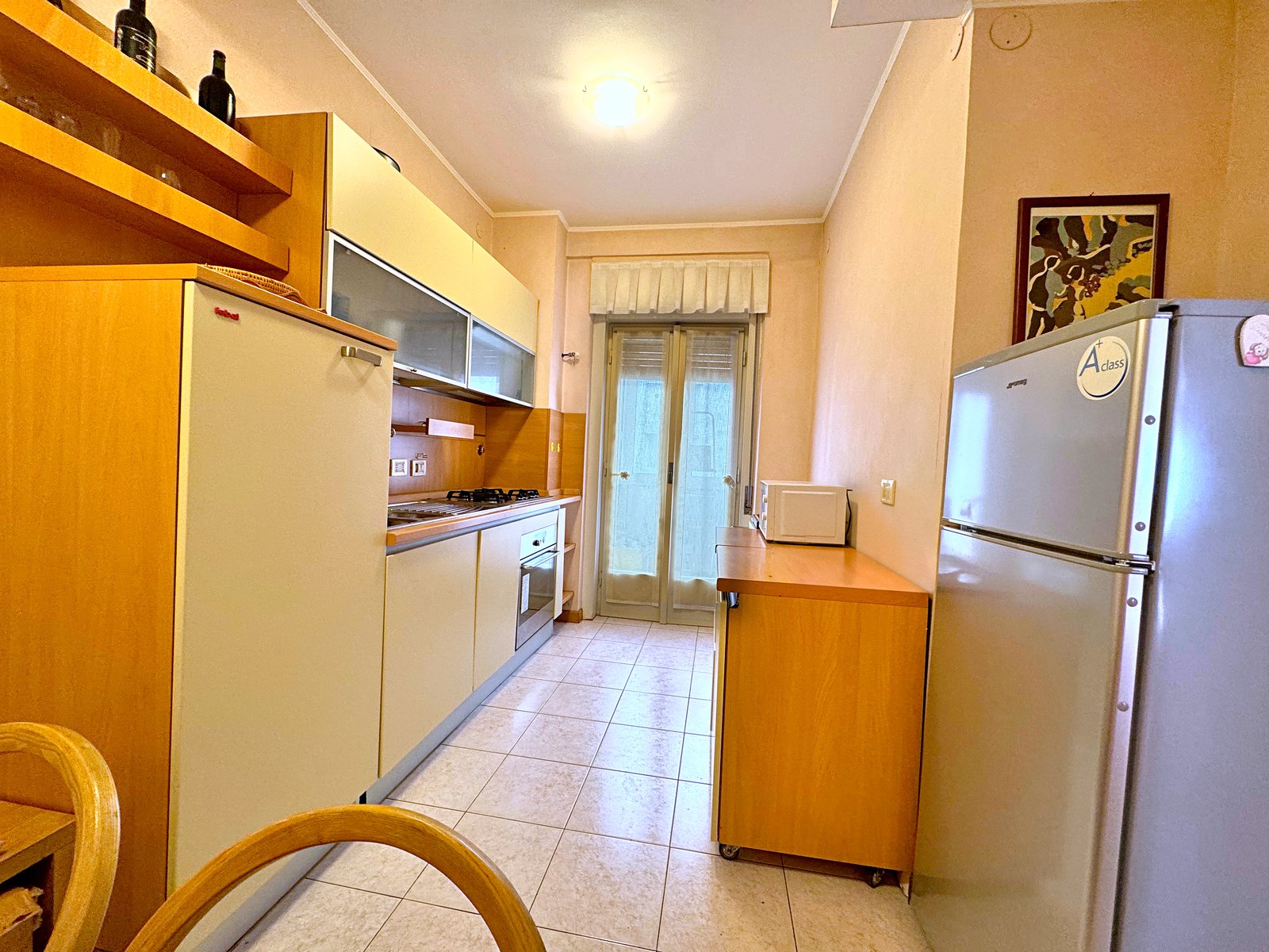 Eat-in kitchen with French window, fridge and hob, flat in Via San Francesco d'Assisi, Trieste