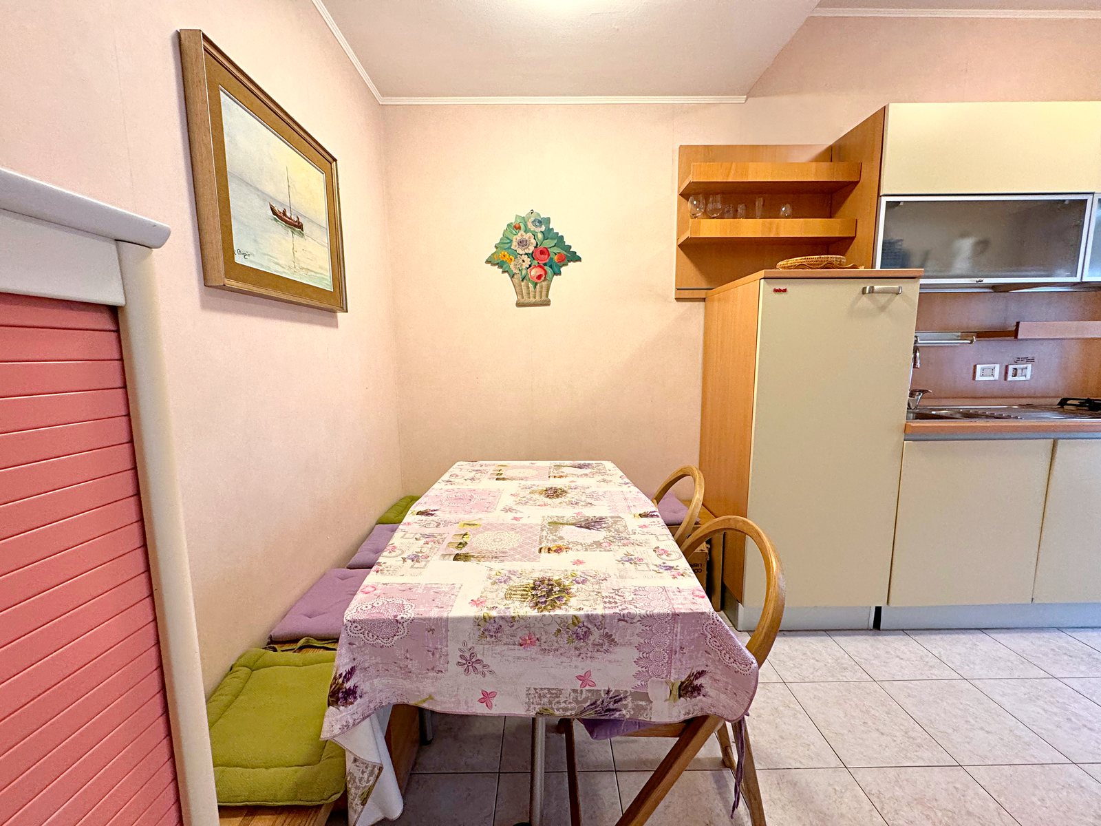 Kitchen dining corner with table, bench and wooden shelves, Via San Francesco d'Assisi, Trieste