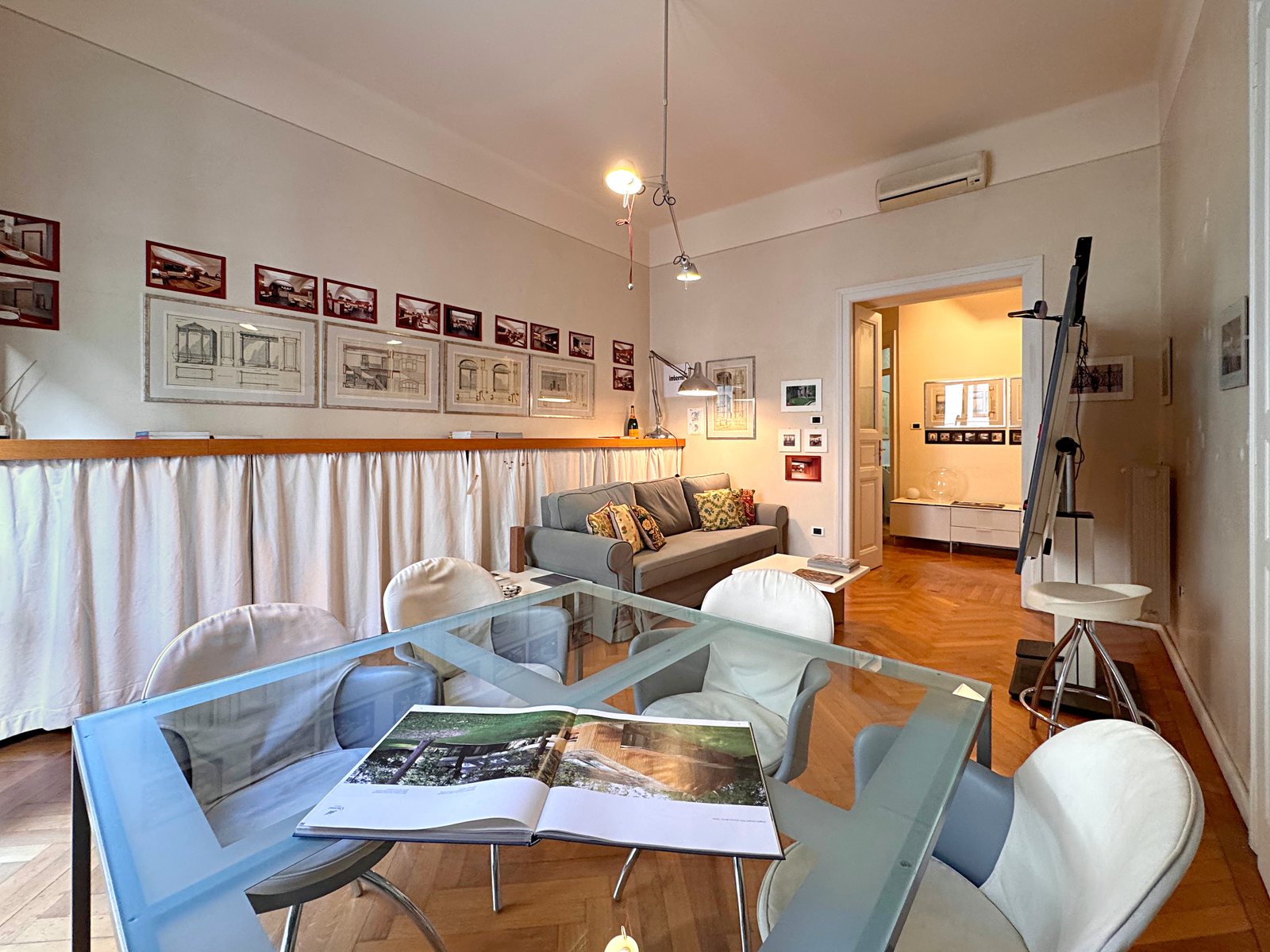 Sitting room with glass table and chairs, seen from the window towards the hall, Via Santa Caterina, Trieste